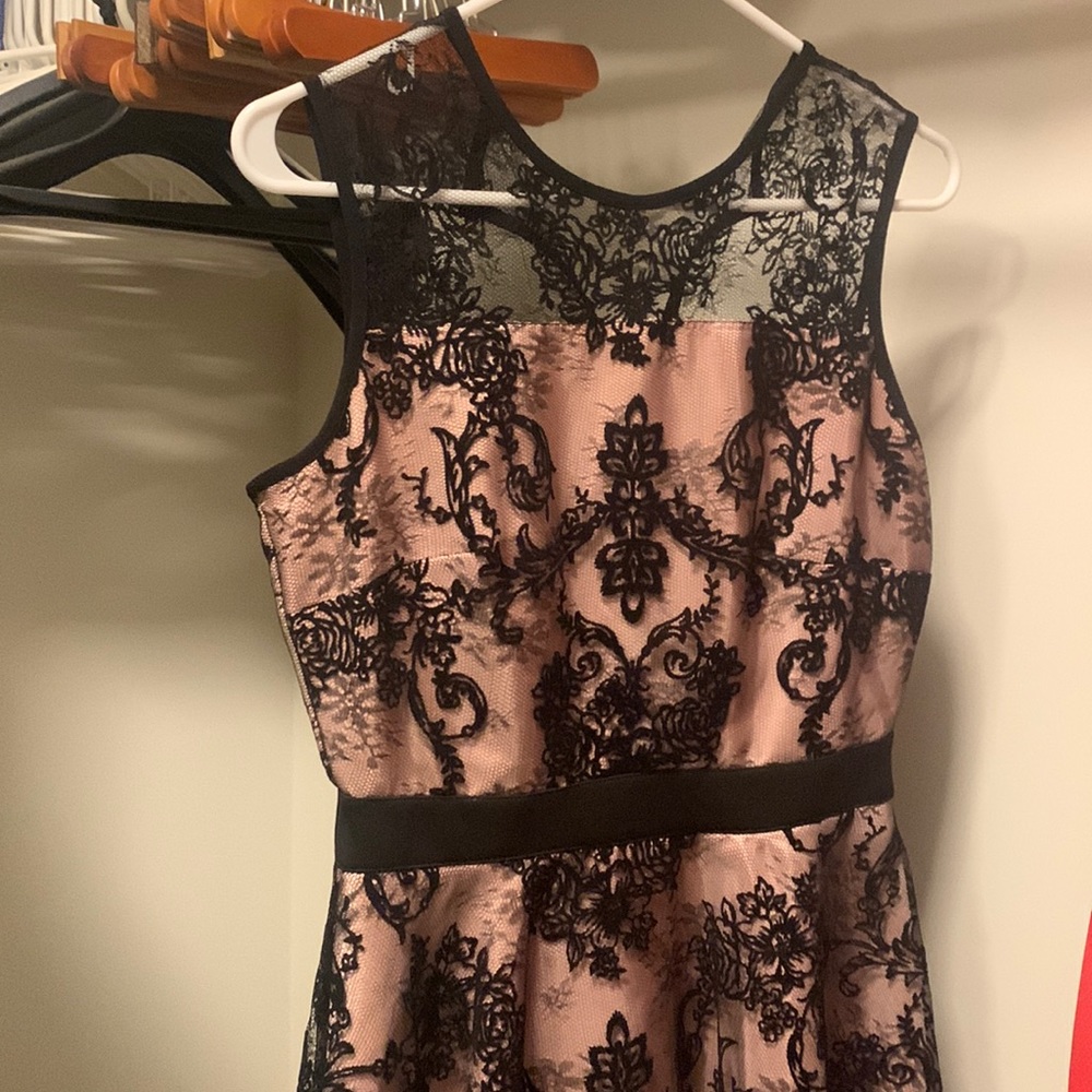 Pink dress with black velvet lace.